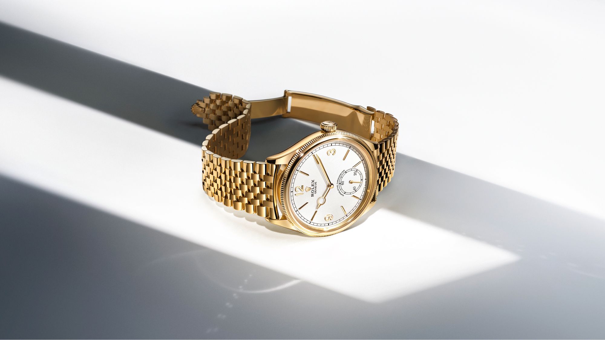 Rolex 1908 in Gold mit weißem Zifferblatt