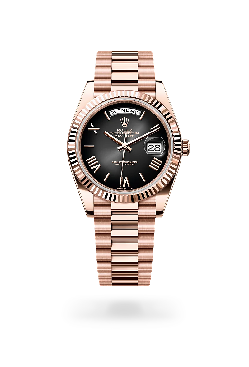 Rolex Day-Date 40, Kratzfestes Saphirglas, Zykloplupe zur Vergrößerung des Datums, President, dreireihig, halbrunde Elemente